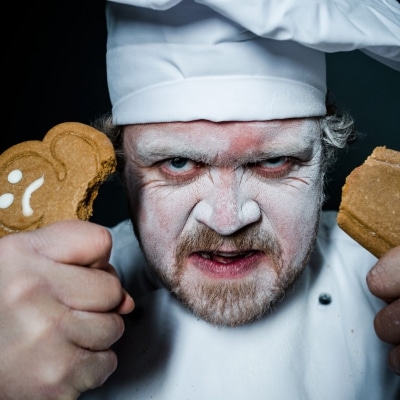 angry Chef holding broken gingerbread man
